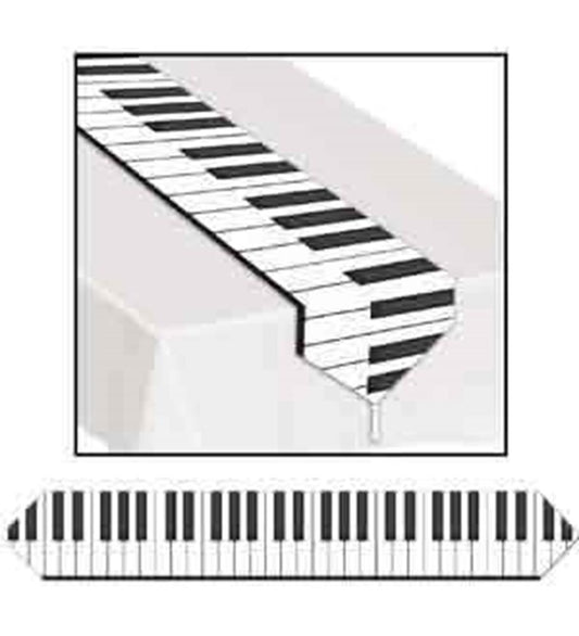 Long rectangular white table runner with black and white piano keyboard design along its length.