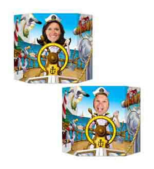 Wooden nautical captain’s wheel photo prop painted yellow with black spokes and a central anchor emblem for kids’ birthday.