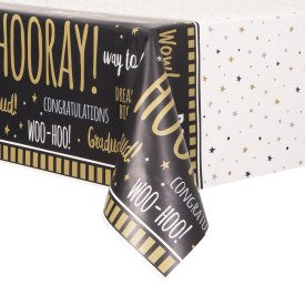 Black and white plastic tablecover with gold and white graduation-themed text and star patterns, measuring 54x84 inches.