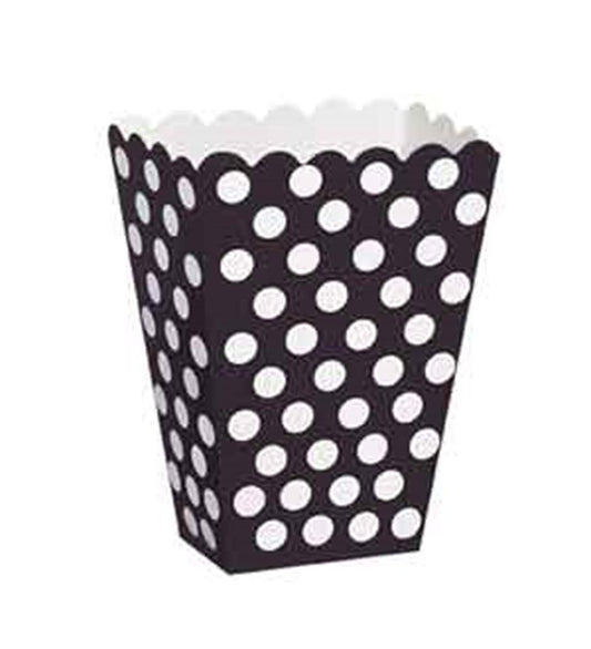 Black treat box with white polka dots and scalloped top edge.