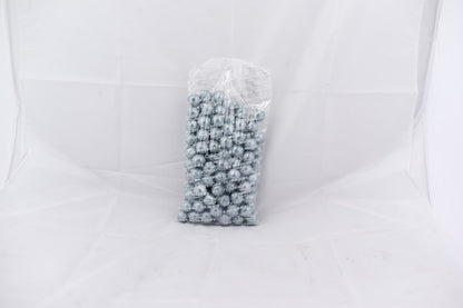 Clear plastic bag filled with shiny silver gumballs tightly packed inside.
