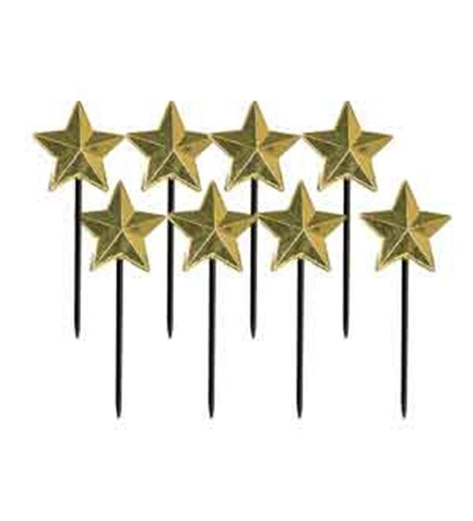 Set of eight gold star-shaped cake toppers with black sticks for party decoration.