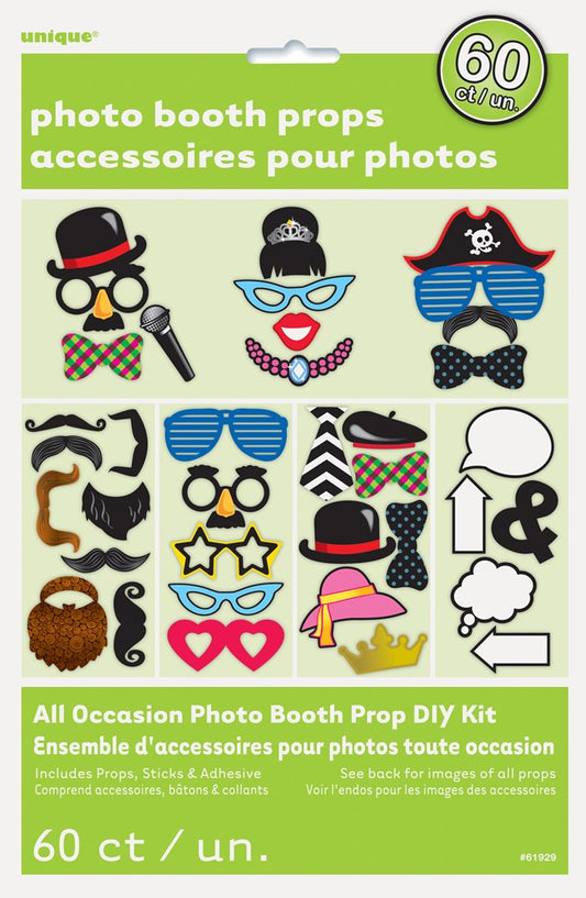 Colorful photo booth props including glasses, hats, mustaches, and speech bubbles on a green backing card.
