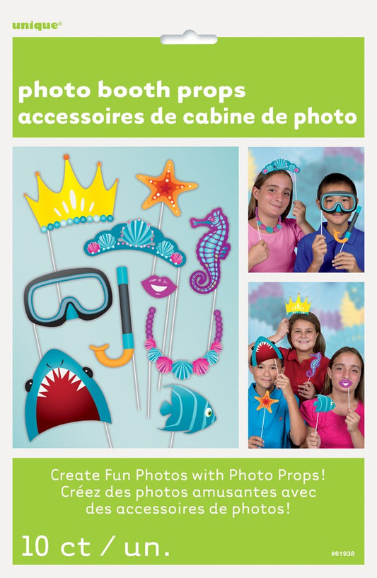 Colorful under the sea photo booth props including yellow crown, pink sea horse, orange starfish, blue diving mask, red.