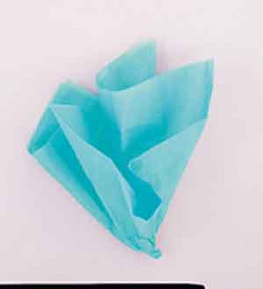 Teal-colored tissue paper folded into a decorative fan shape with a soft, lightweight texture.