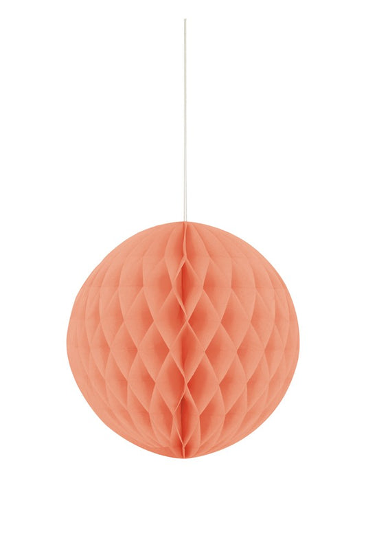 Coral honeycomb paper ball decoration hanging with intricate geometric pattern.