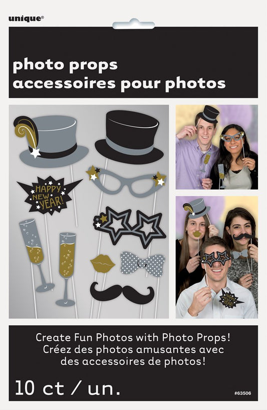 Set of 10 New Year’s photo props including gray and black top hats, star-shaped glasses, speech bubbles, champagne flutes,.