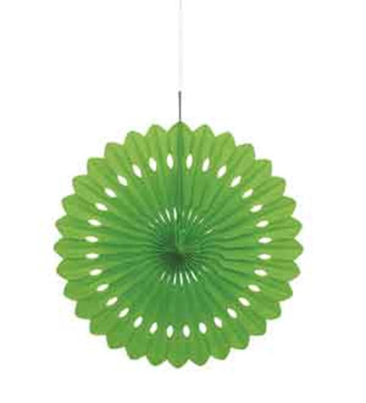 Lime green circular tissue paper fan with scalloped edges and hole pattern hanging by white string.