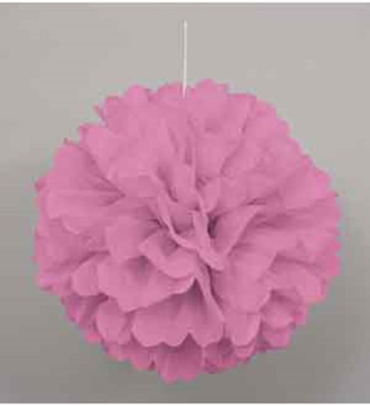 Hot pink round tissue paper pom pom with layered ruffled petals hanging by a white string.