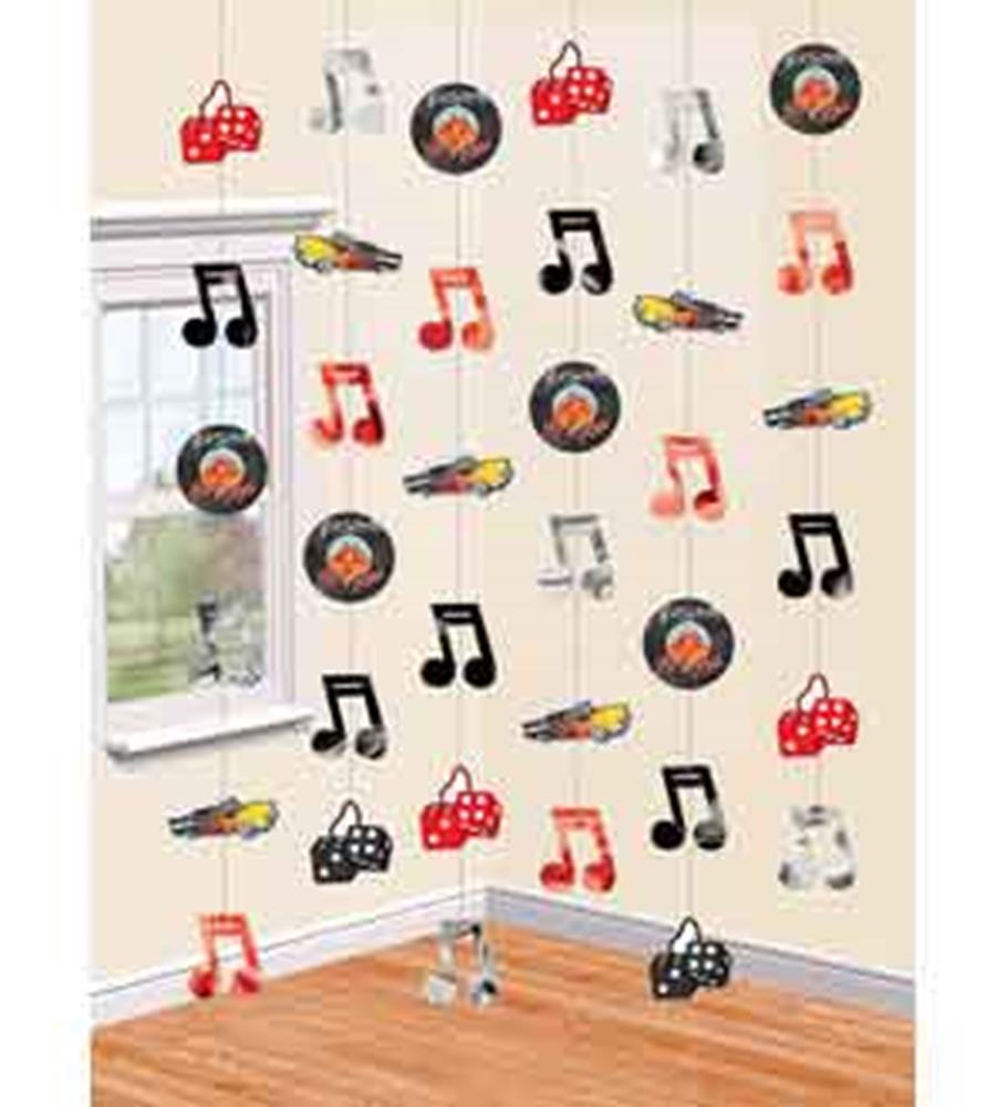 Colorful 50s-themed hanging decorations featuring records, dice, musical notes, and classic cars.
