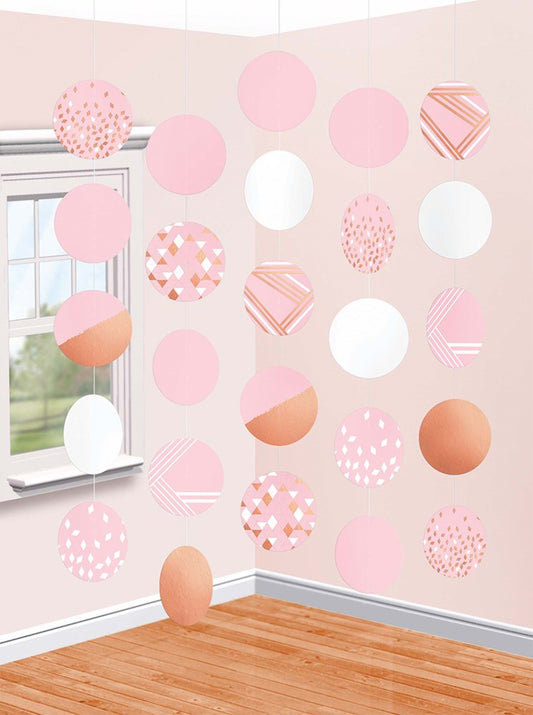 Rose gold and blush hanging circle decorations with various patterns and solid colors, five strands.