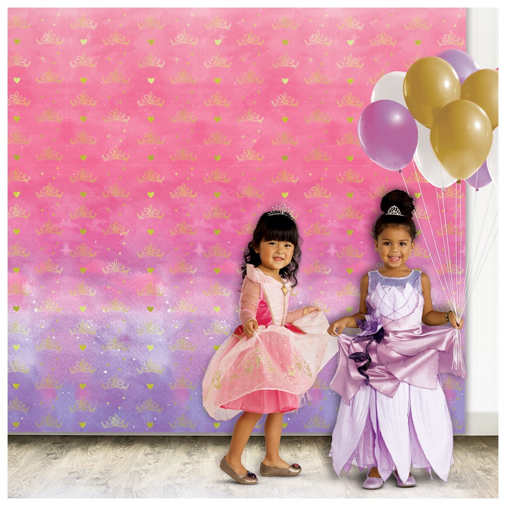 Pink and purple gradient Disney Princess photo backdrops with gold crown motifs, displayed behind two girls in princess.