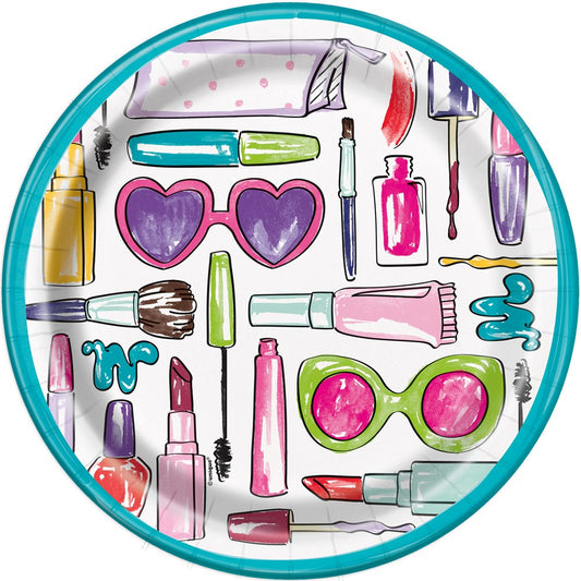 Round paper plate with colorful spa-themed illustrations including nail polish, lipstick, makeup brushes, and sunglasses on.