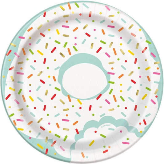 Round white paper plate with pastel teal rim, decorated with colorful sprinkle pattern and partial donut design.
