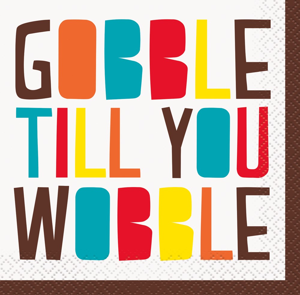 Colorful block letters spelling "GOBBLE TILL YOU WOBBLE" on a square white napkin with a brown border.