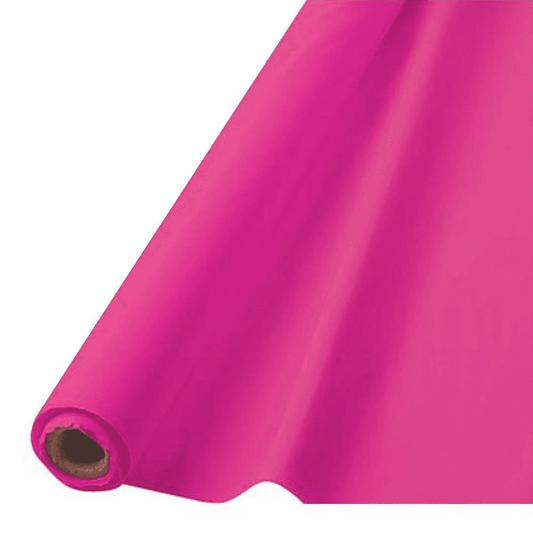 Bright pink disposable table roll unrolled from a large cylindrical core.