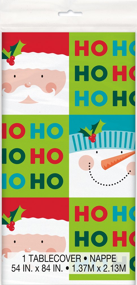 Red and green plastic tablecover with Santa face, snowman, holly, and colorful "Ho Ho Ho" blocks.