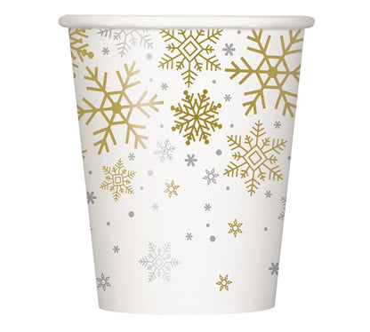 White paper cup decorated with gold and silver snowflakes in various sizes.