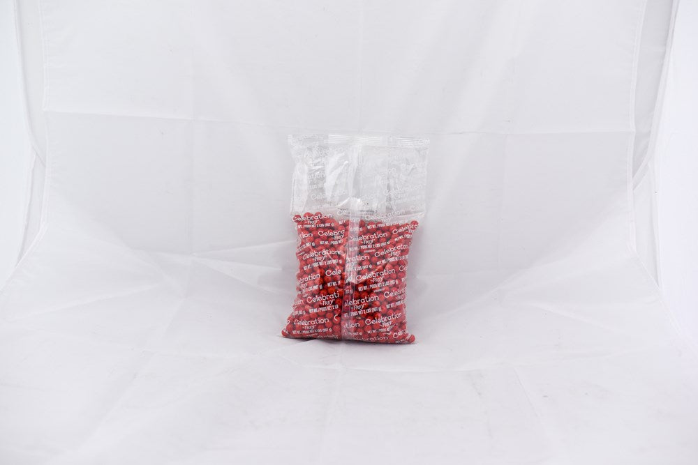 Clear plastic bag filled with small red pellets labeled SiXLets Red 2lb bag.