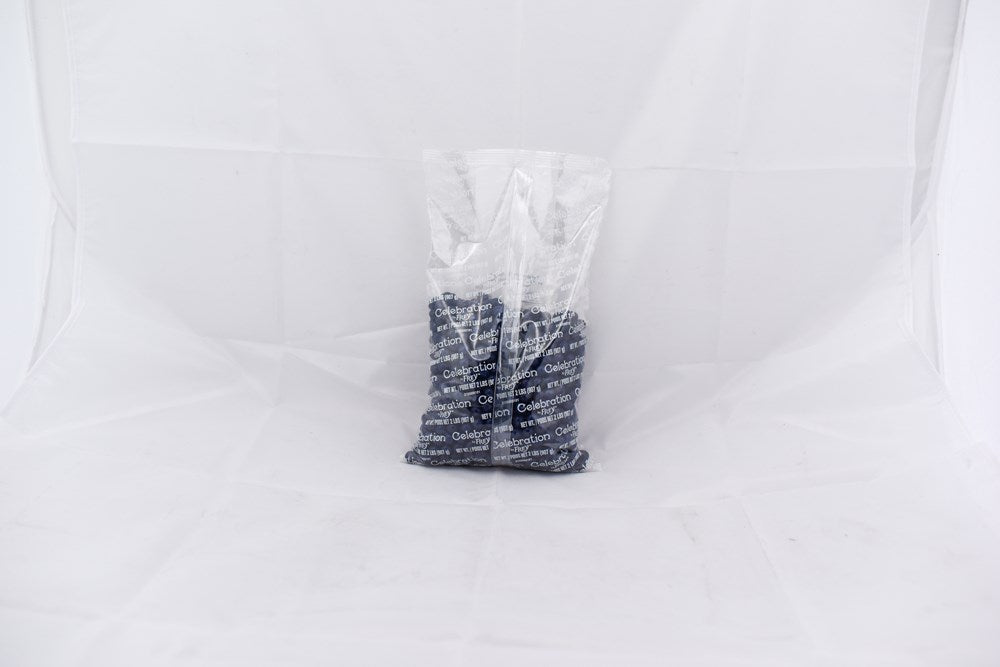 Clear plastic bag containing multiple navy blue SiXLets exercise balls stacked inside.
