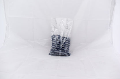 Clear plastic bag containing multiple navy blue SiXLets exercise balls stacked inside.
