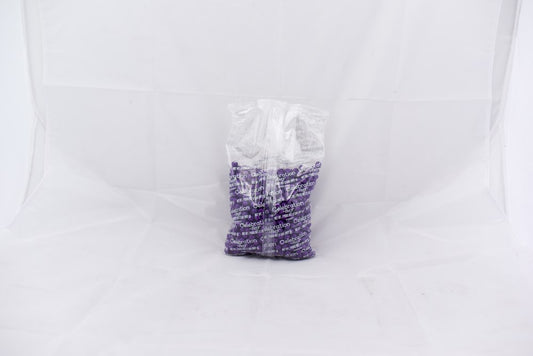 Transparent plastic bag filled with small dark purple SiXLets pellets on a white background.