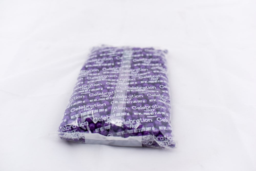 Clear plastic bag filled with small, dark purple rectangular pellets labeled SiXLets 2lb pack.