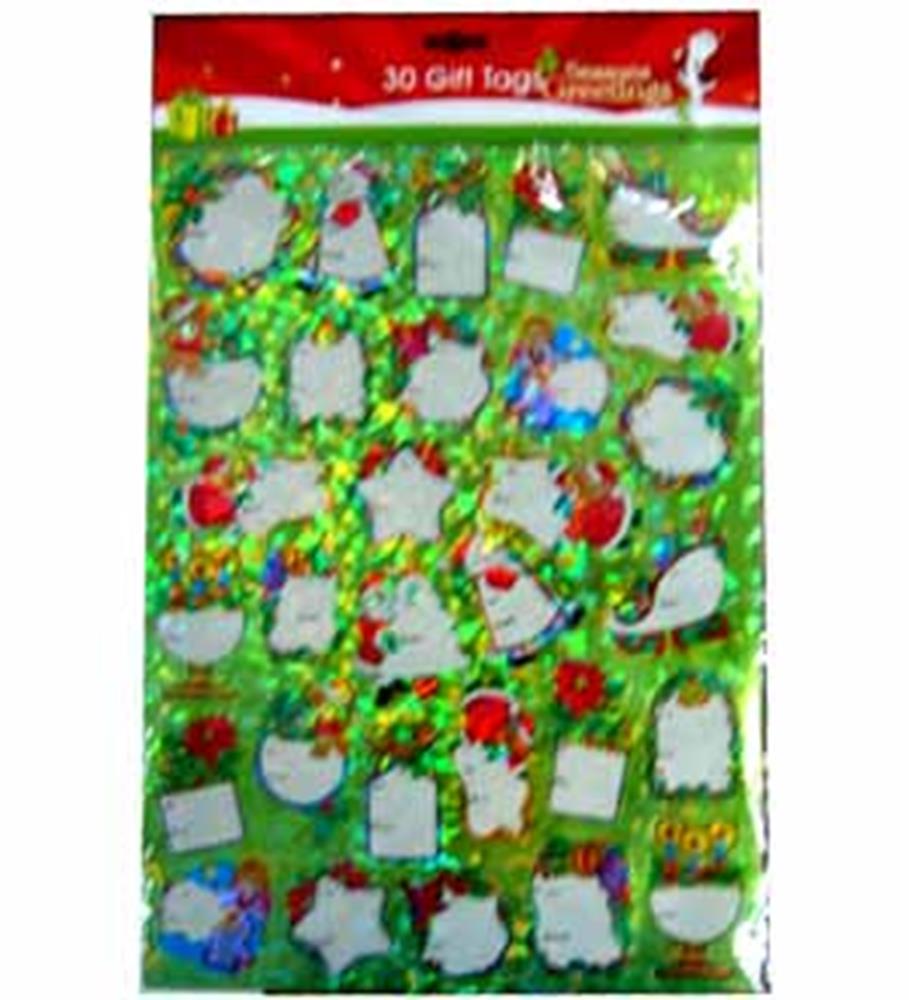 Assorted colorful Christmas gift tags in various festive shapes with self-stick backing on green holiday-themed backing.