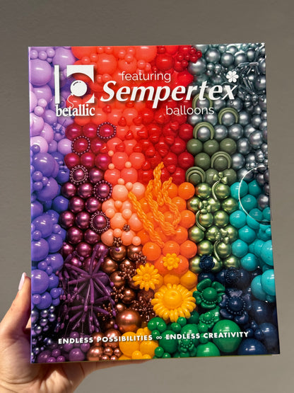 Sempertex balloon color portfolio featuring metallic balloons in purple, red, black, orange, green, and teal on a held.