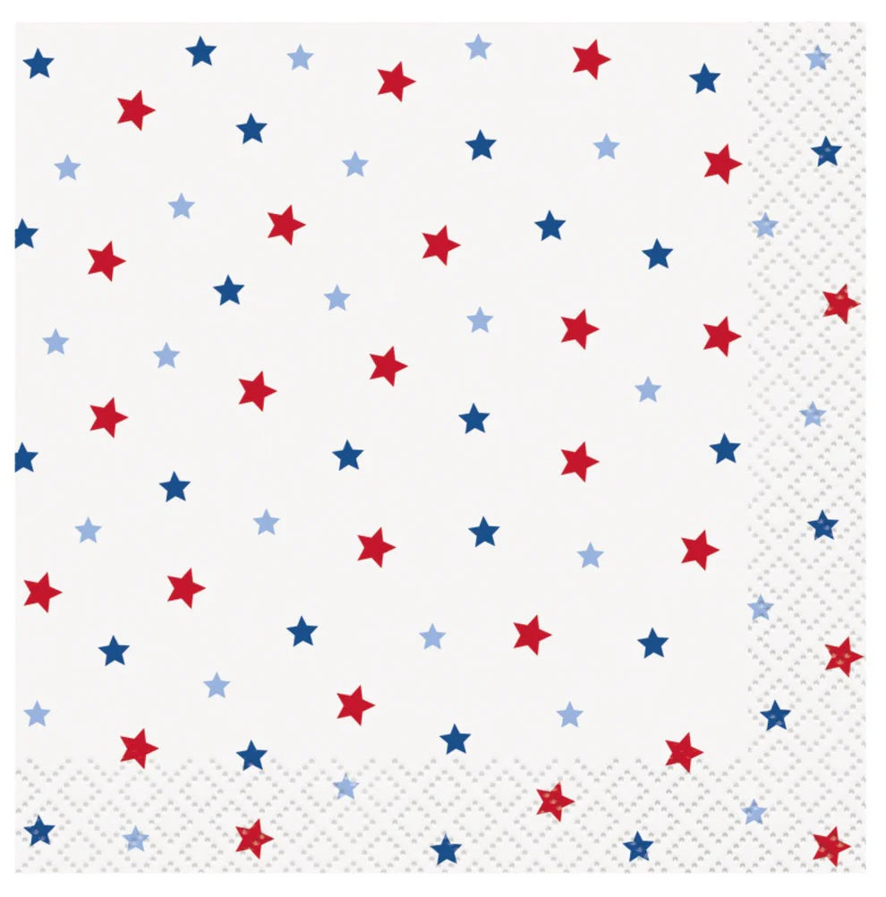 White beverage napkin with scattered red and blue stars and a subtle textured border pattern.