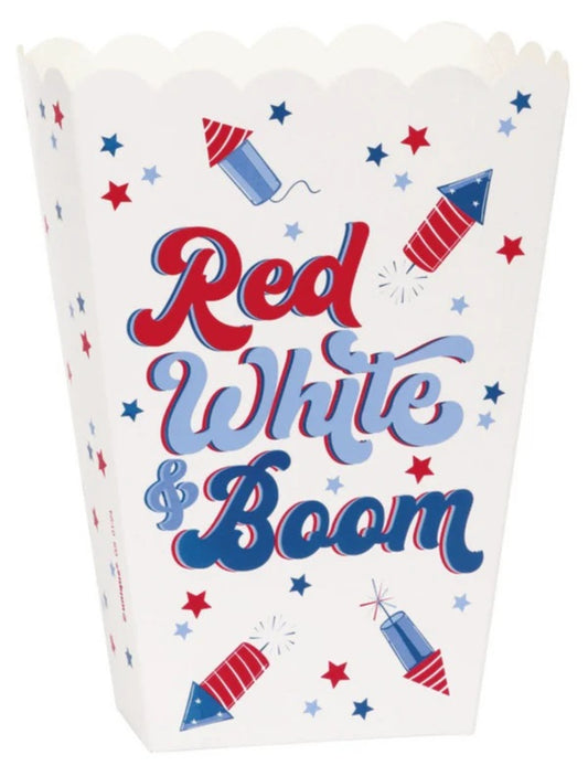 White popcorn box with scalloped top edge featuring red, white, and blue fireworks and lettering reading "Red White & Boom".