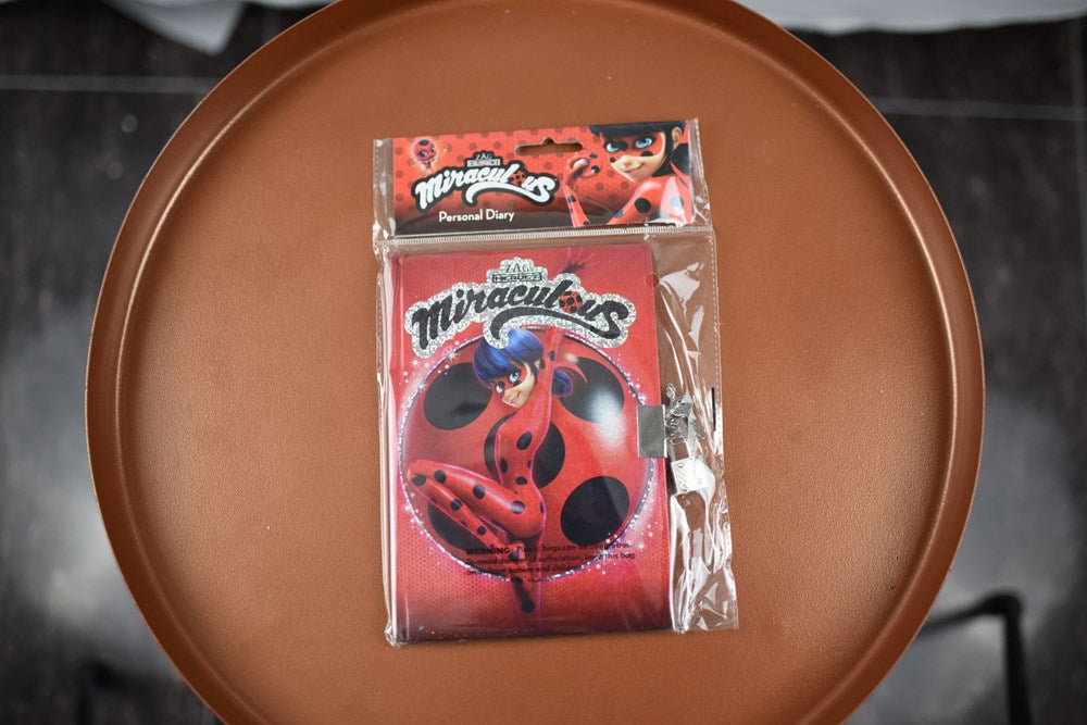Red Miraculous Ladybug foil-stamped diary with 50 sheets, featuring ladybug and polka dot design.