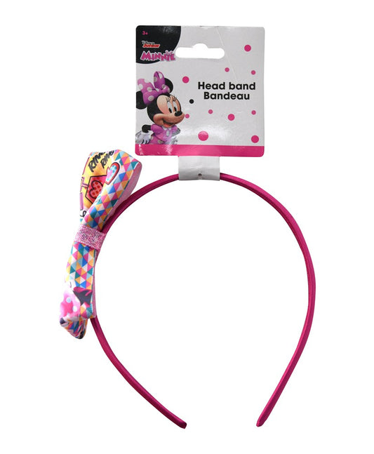 Pink plastic headband with a multicolored Minnie Mouse-themed fabric bow and polka dot packaging card.