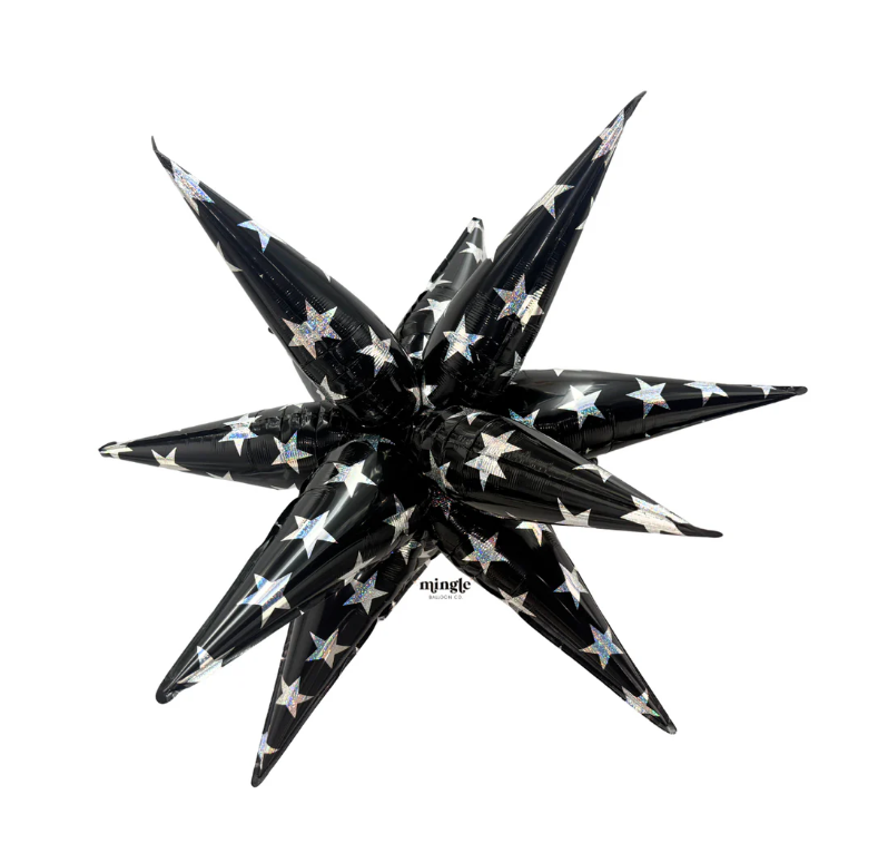32-inch black starburst balloon with silver sparkle star pattern, pointed elongated shape.