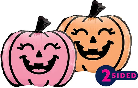 Two-sided 12-inch foil balloon shaped like smiling jack-o'-lanterns in pink and orange with black facial features and stems.