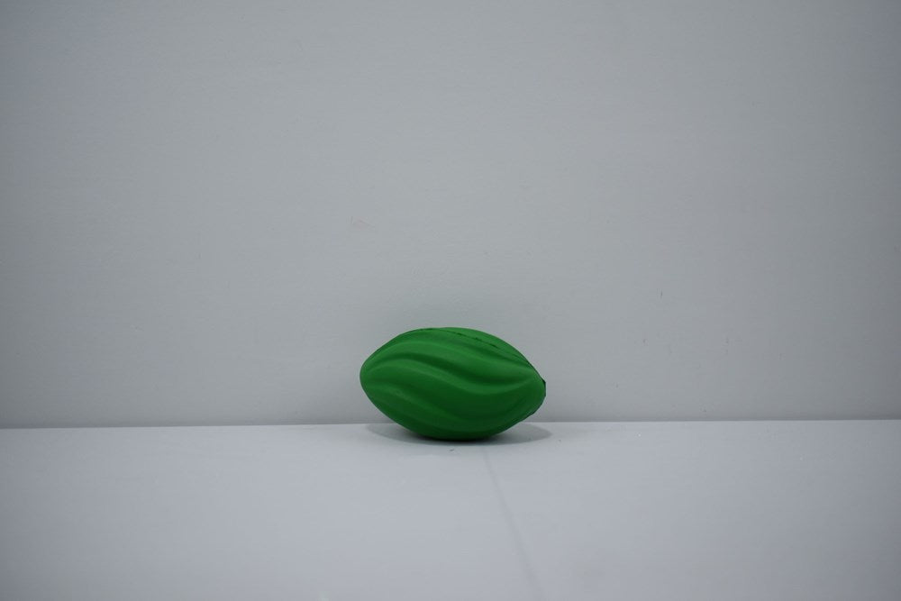 Small green foam football with a spiral texture, 7-inch size for kids' play.