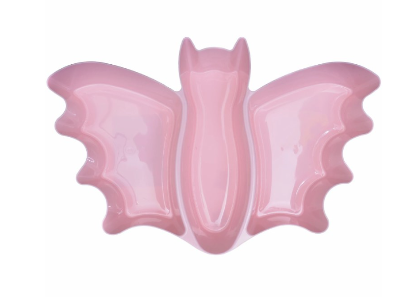 Pastel pink ceramic platter shaped like a bat with defined wings and bat ears.
