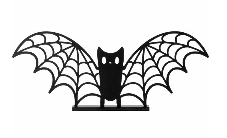 Black metal standing sign shaped like a bat with web-patterned wings and round eyes.