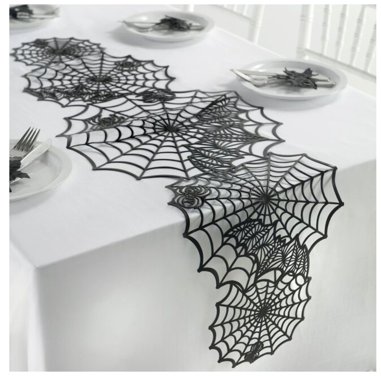 Black vinyl table runner shaped like connected spider webs, ideal for Halloween decor.