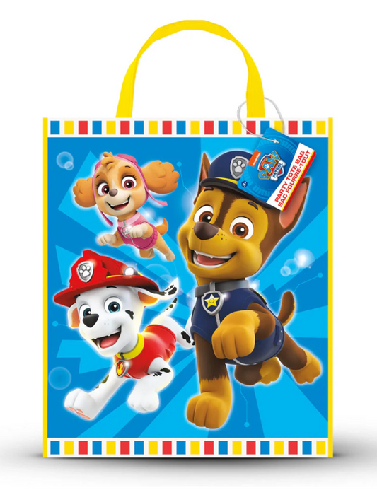 Blue Paw Patrol tote bag with yellow handles, featuring Chase, Marshall, and Skye cartoon characters and colorful striped.