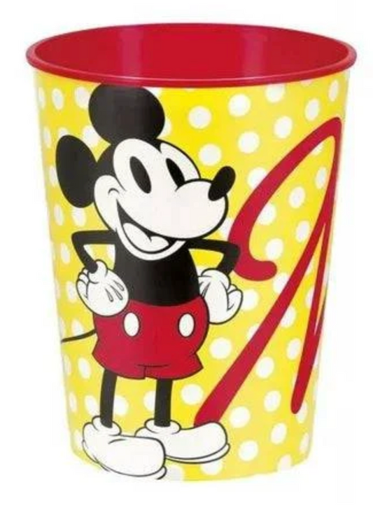 Yellow cup with white polka dots featuring classic Mickey Mouse in red shorts, red interior, 16-ounce capacity.