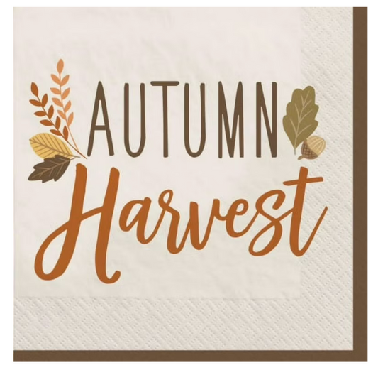 White paper napkin with brown border and "Autumn Harvest" text in brown and orange, decorated with fall leaves.