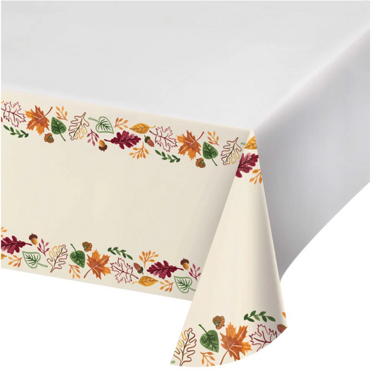 Cream paper tablecover with colorful fall leaves and acorns border print.