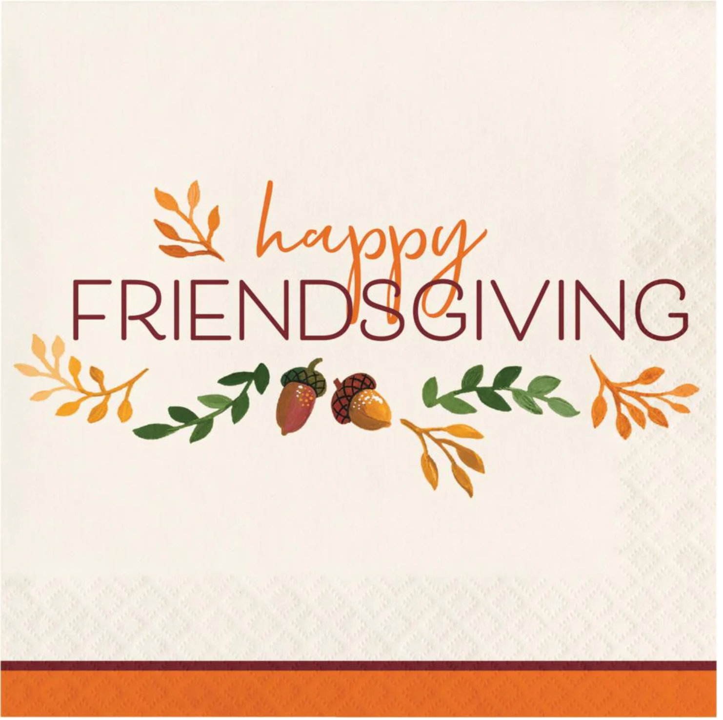 White luncheon napkin with orange border, "Happy Friendsgiving" text, and fall leaves and acorns design.