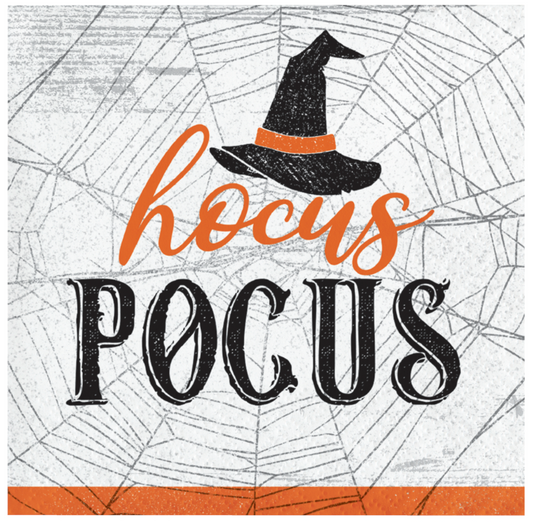 Square beverage napkin with black spiderweb background, "hocus pocus" text in orange and black, witch hat graphic, and.