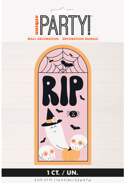 Pink tombstone-shaped Halloween wall decor with black RIP text, a ghost wearing a witch hat, bats, spider web, and two white