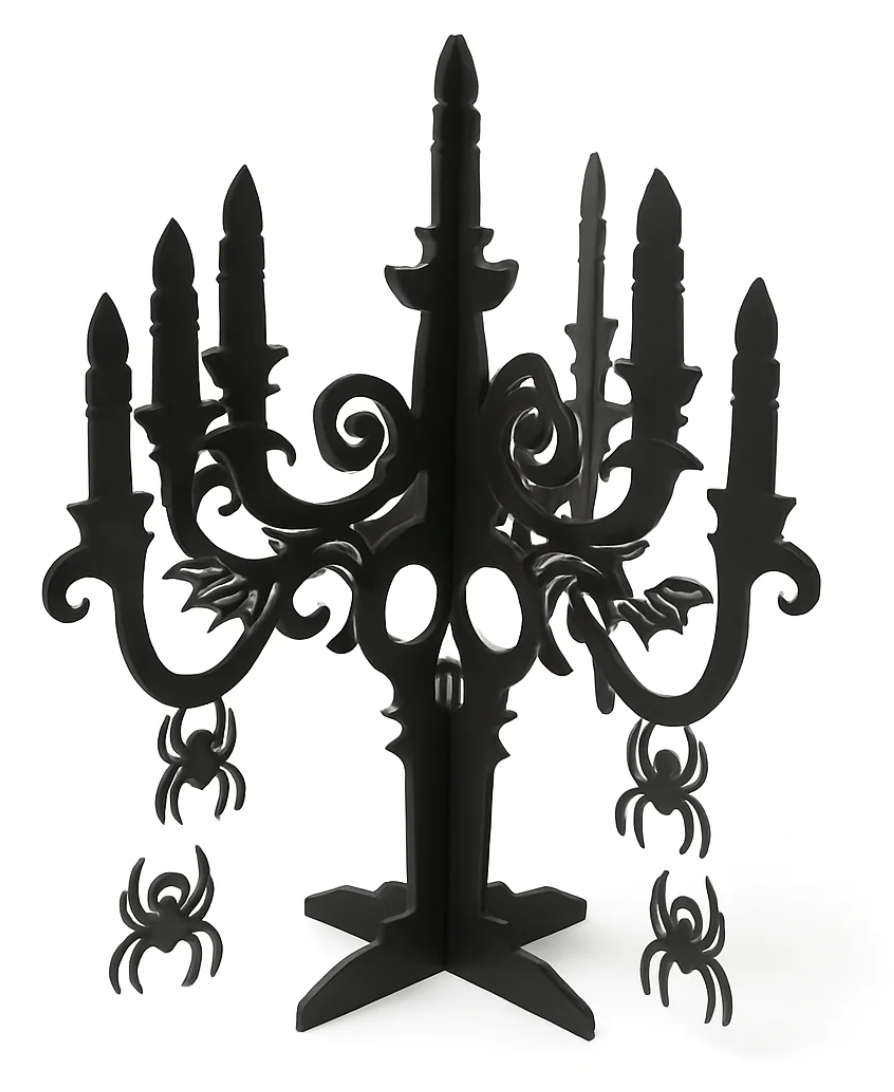 Black plastic 3D candelabra centerpiece with spider and bat cutouts for Halloween decor.