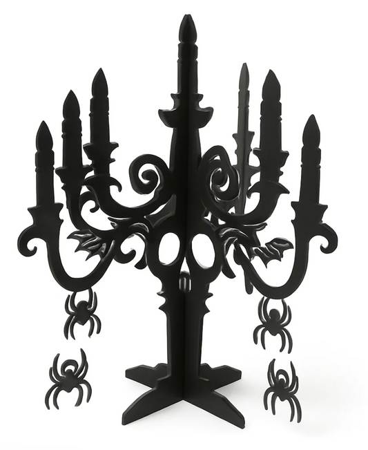 Black plastic 3D candelabra centerpiece with spider and bat cutouts for Halloween decor.