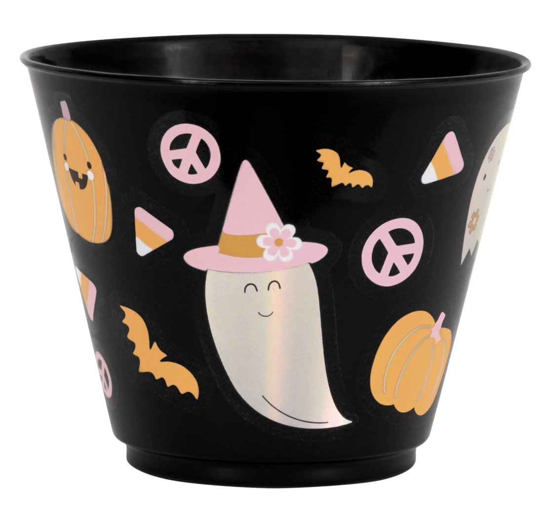 Black plastic tumbler with smiling ghost wearing pink witch hat, pumpkins, bats, candy corn, and pink peace signs.