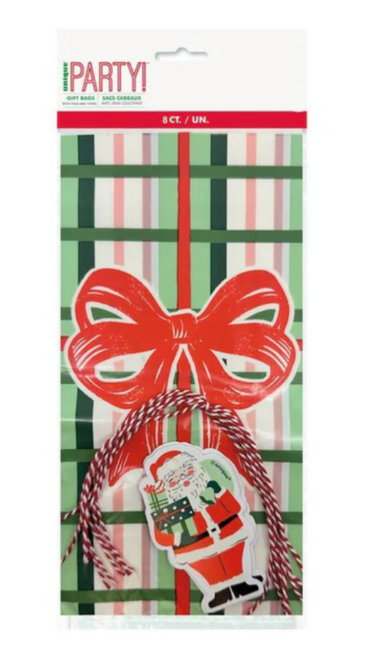 Set of eight vintage Christmas cello bags with green striped pattern, red twine ties, and festive gift tags featuring a red.